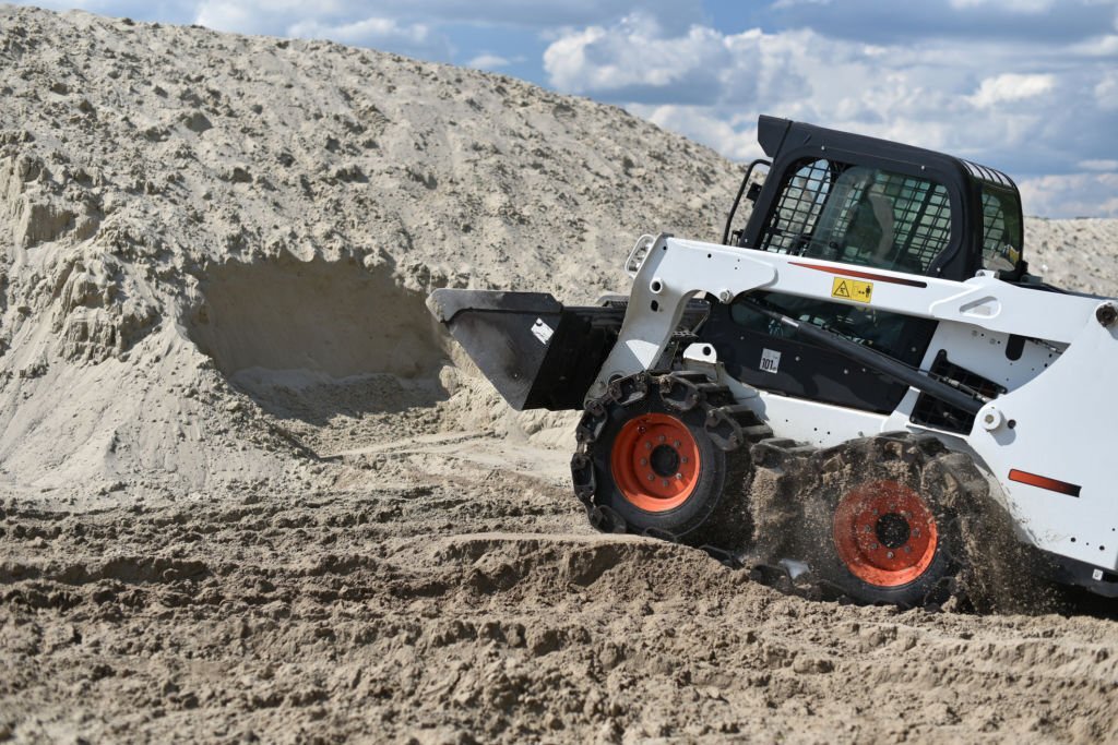 alat berat skid steer loaders