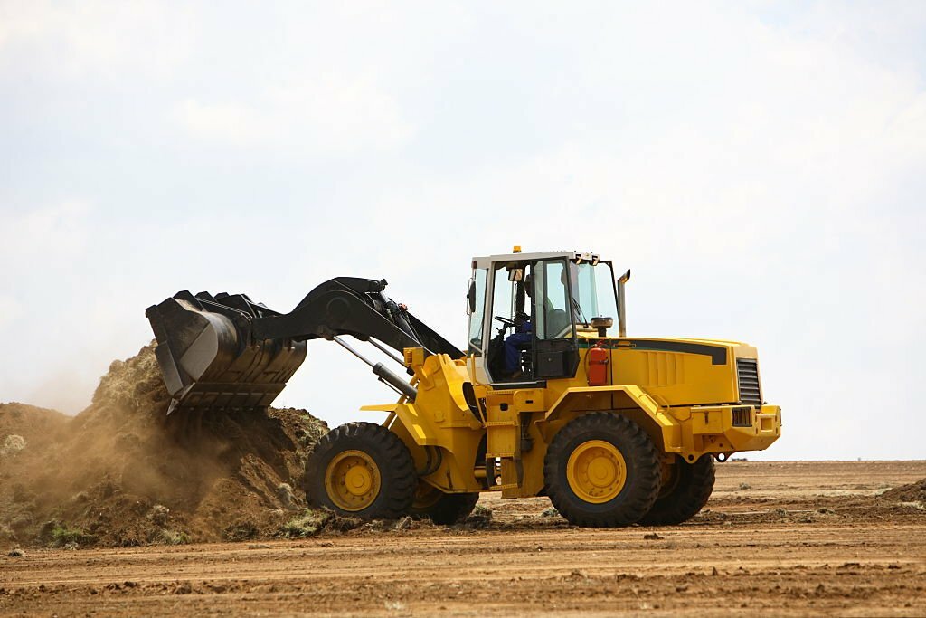 backhoe loader vs bulldozer
