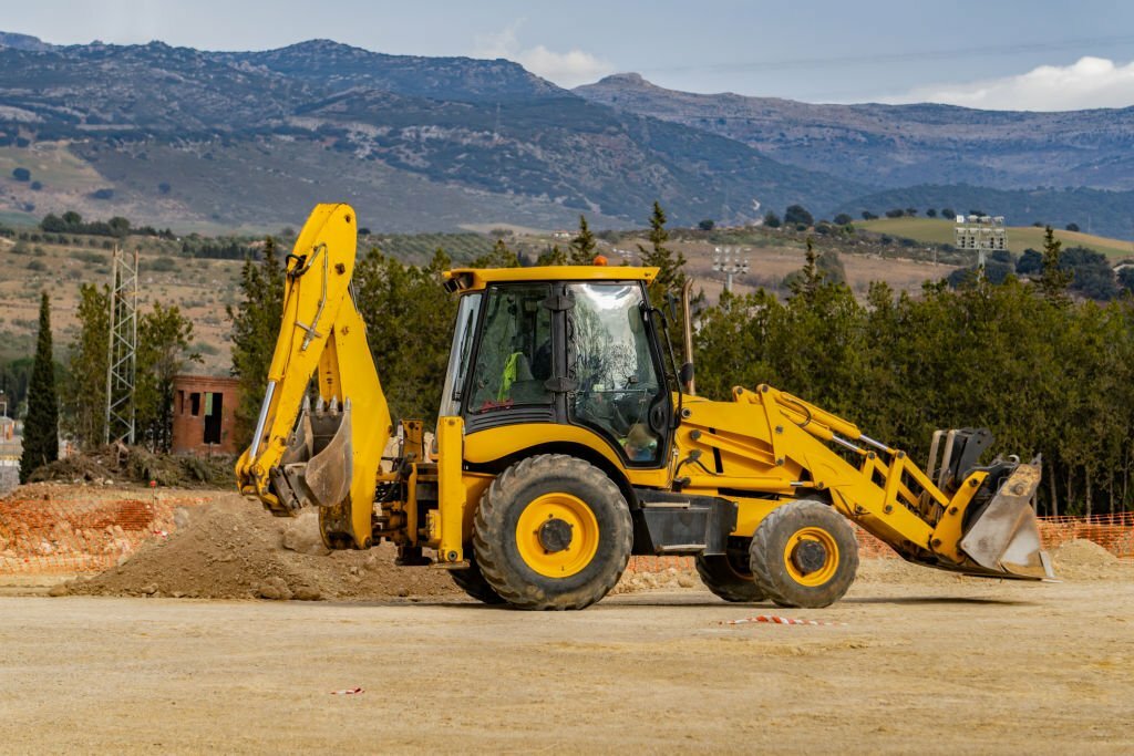 backhoe loader vs bulldozer